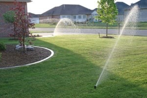 lawn sprinkler system watering a yard