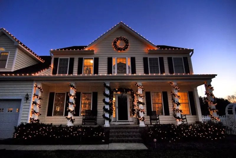 average sized home decorated with christmas lights