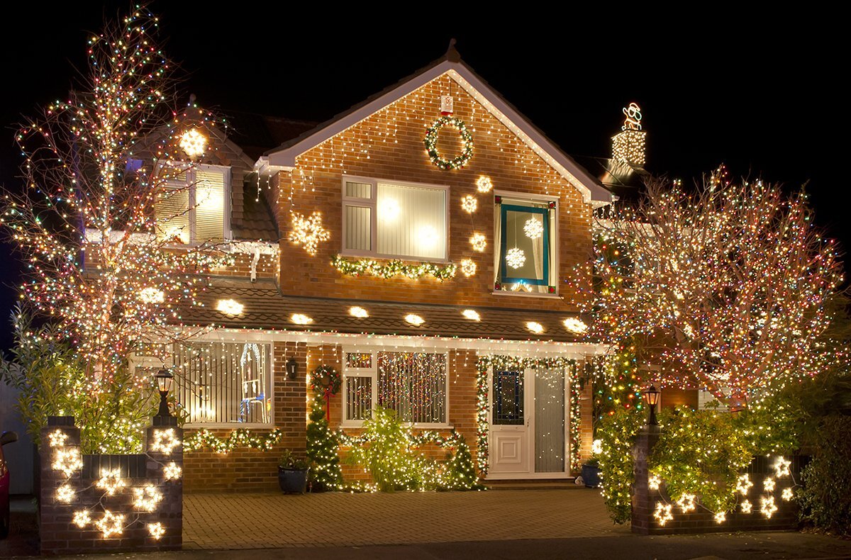 festive house decorated with professional holiday lighting
